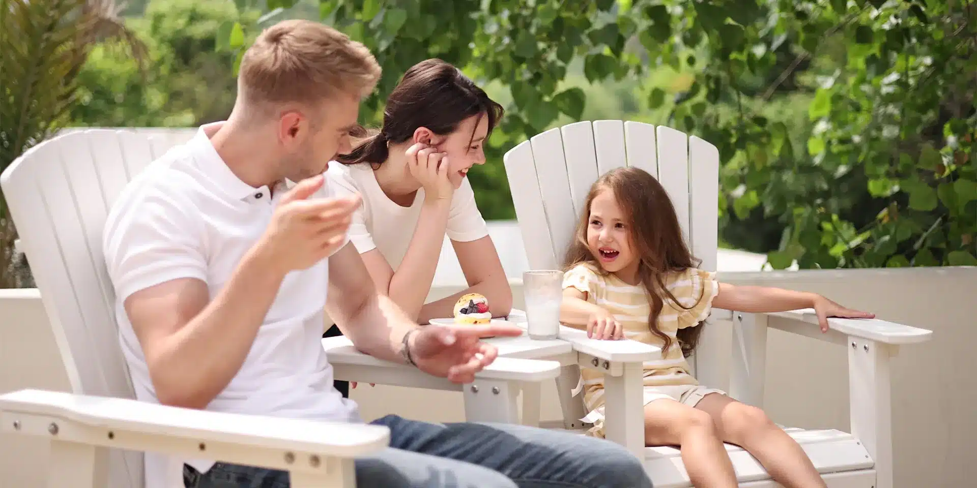 A Family of 3 Chat on the Adirondack Bar Chairs with Table
