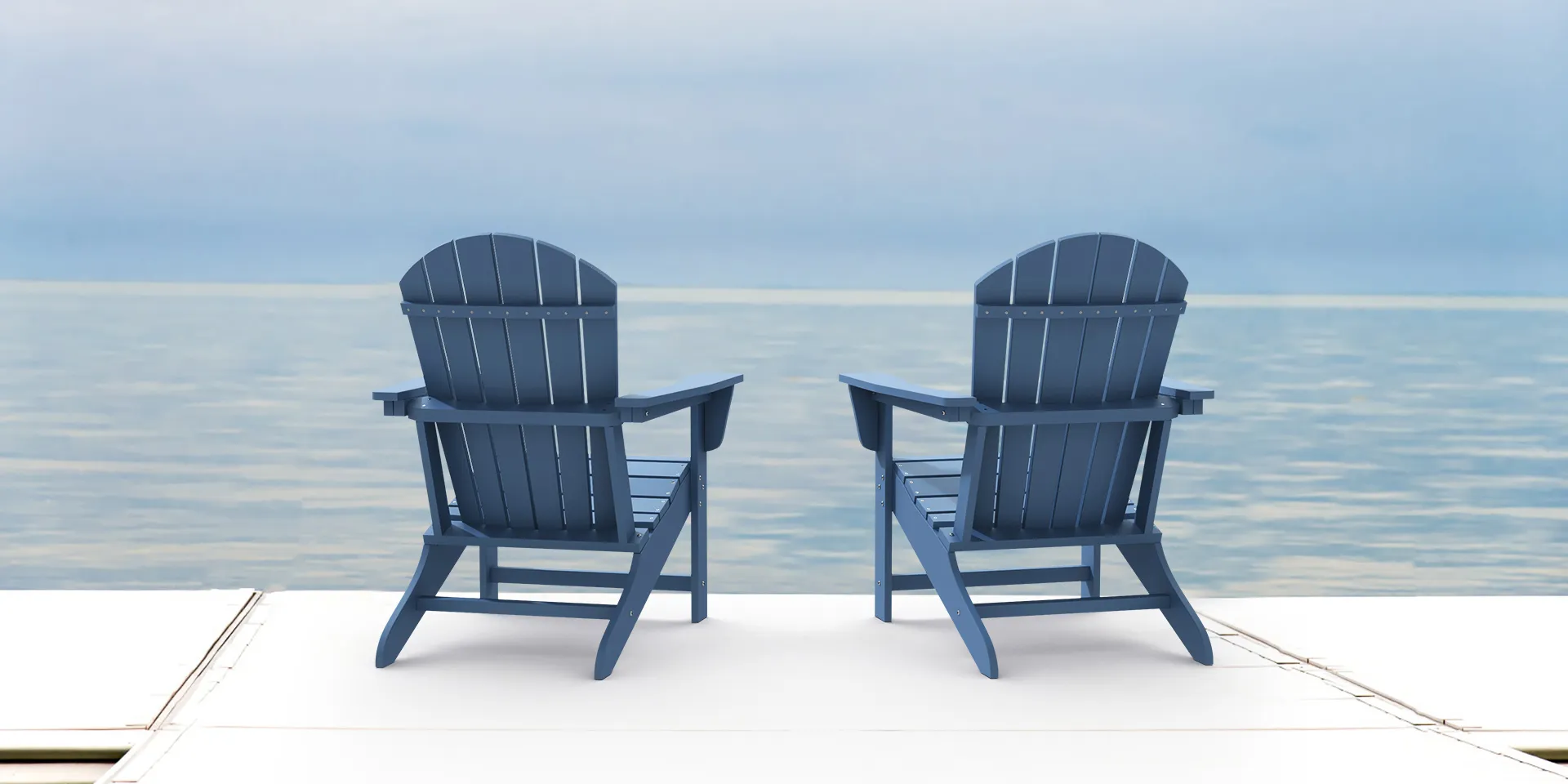 Two Navy Traditional Adirondack Chairs by the sea