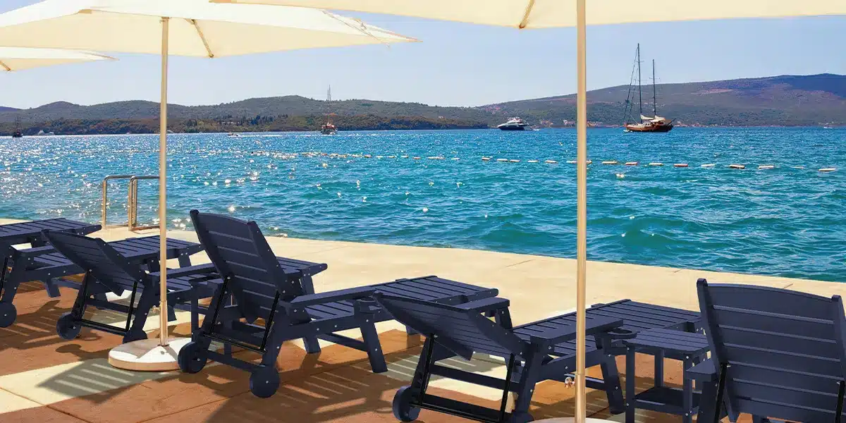 Chaise Lounge Chair with Patio Umbrella by the Lake