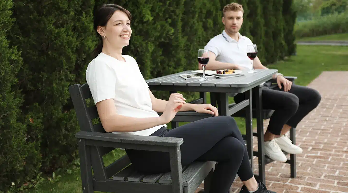 A Couple sit on the Outdoor 3 Piece Bar Set