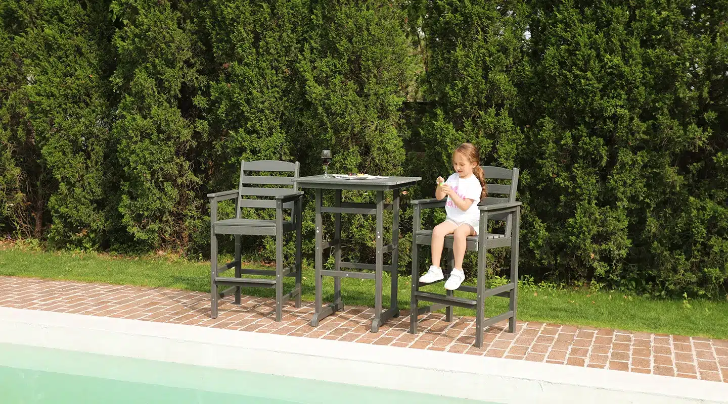 Children playing on the bar table and chairs set