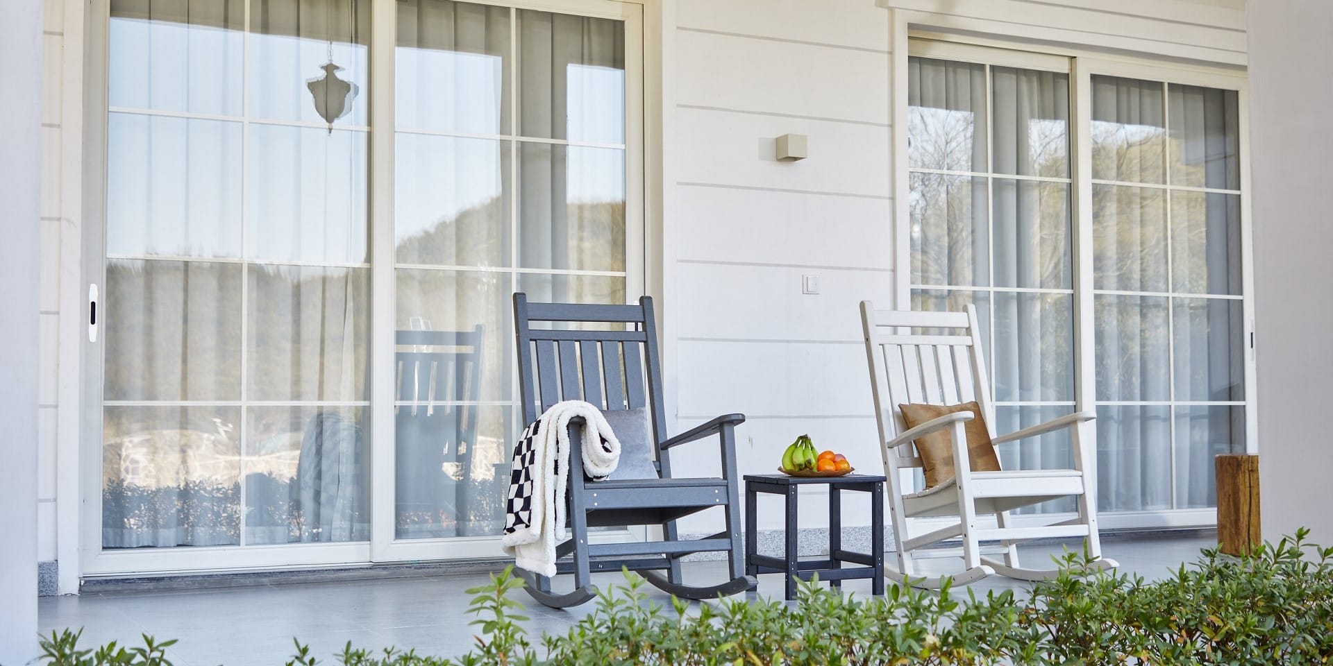 Two front porch rocking chairs on the balcony