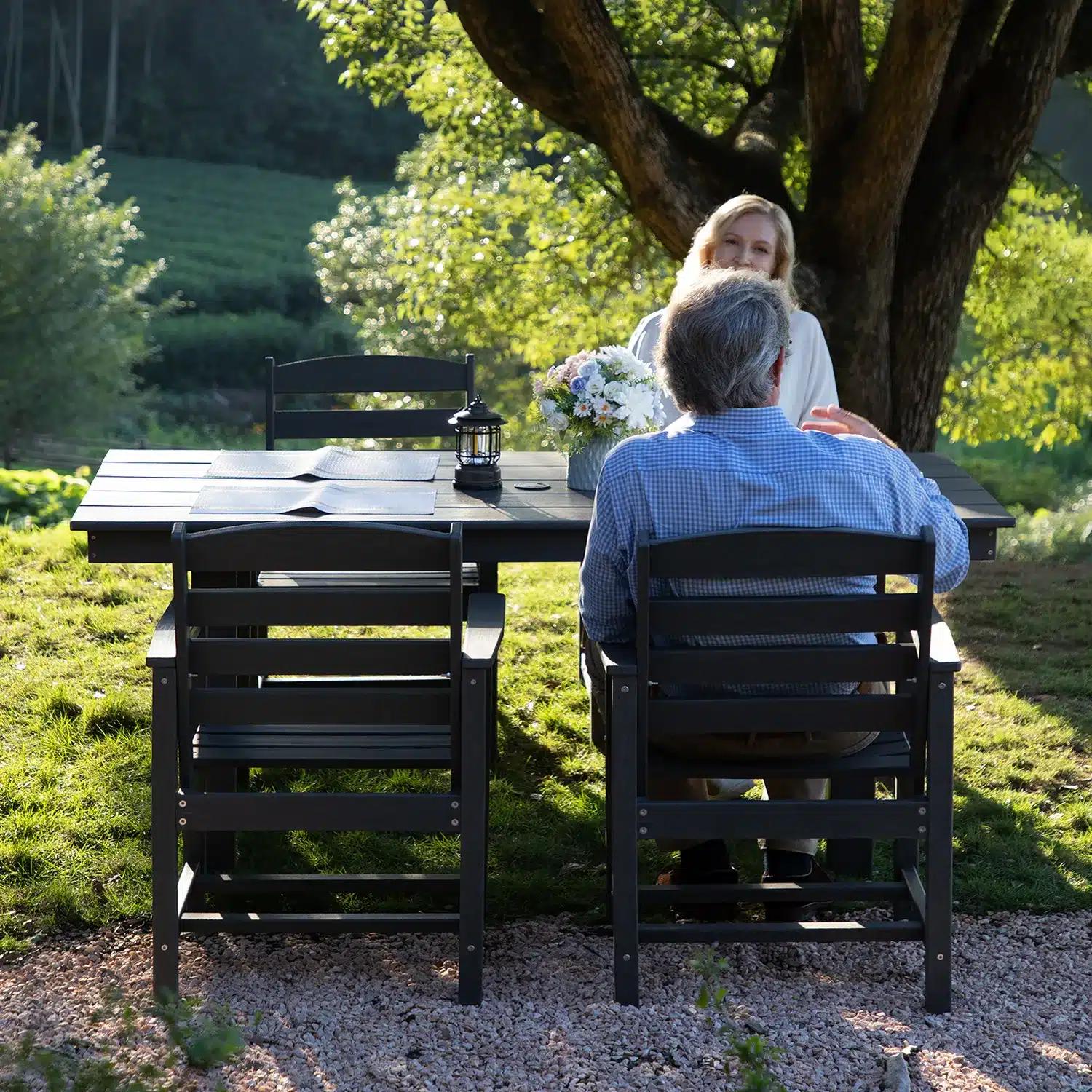 Couple sitting at outdoor table enjoying the view