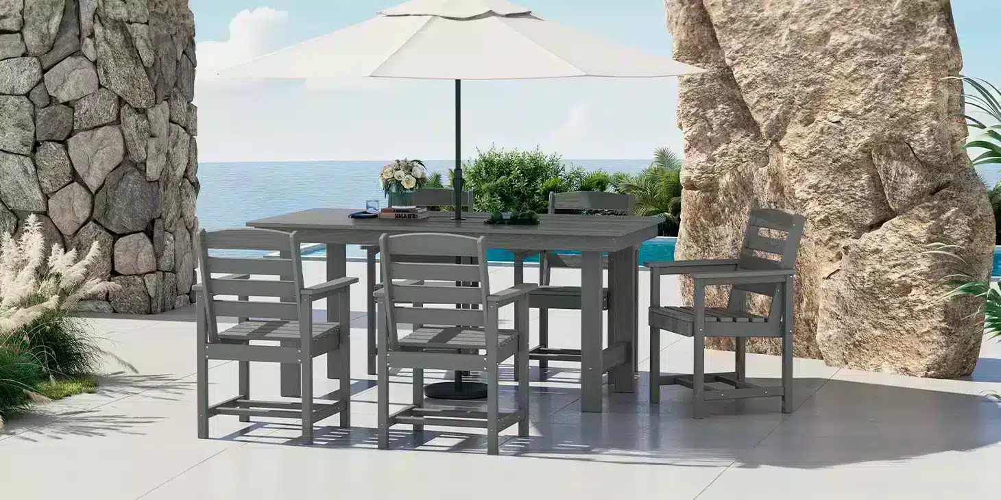 Gray Outdoor Dining Table with Umbrella by the sea