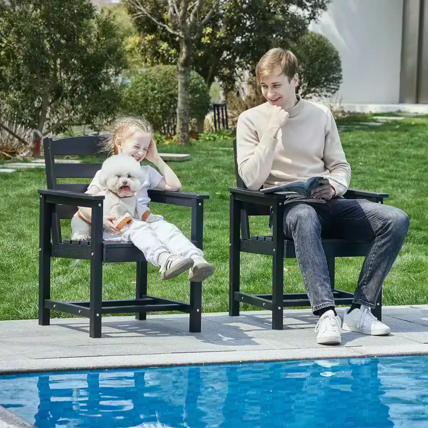 Dad and child playing in outdoor dining armchairs