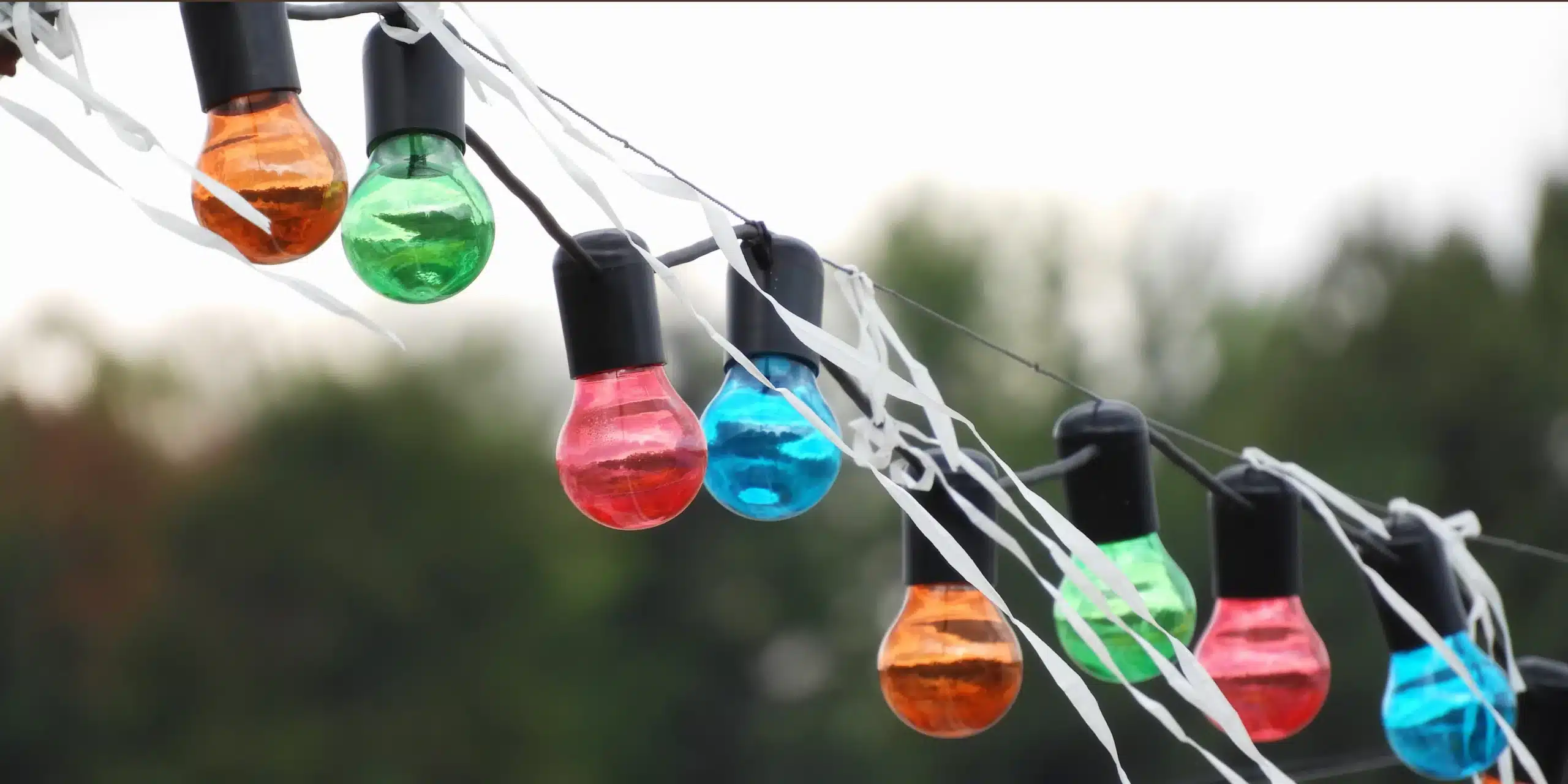 row-colorful-lightbulbs-hanging-string