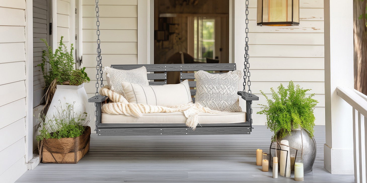 Dark Gray Hanging Porch Swing Chair with Cushions on the Front Porch