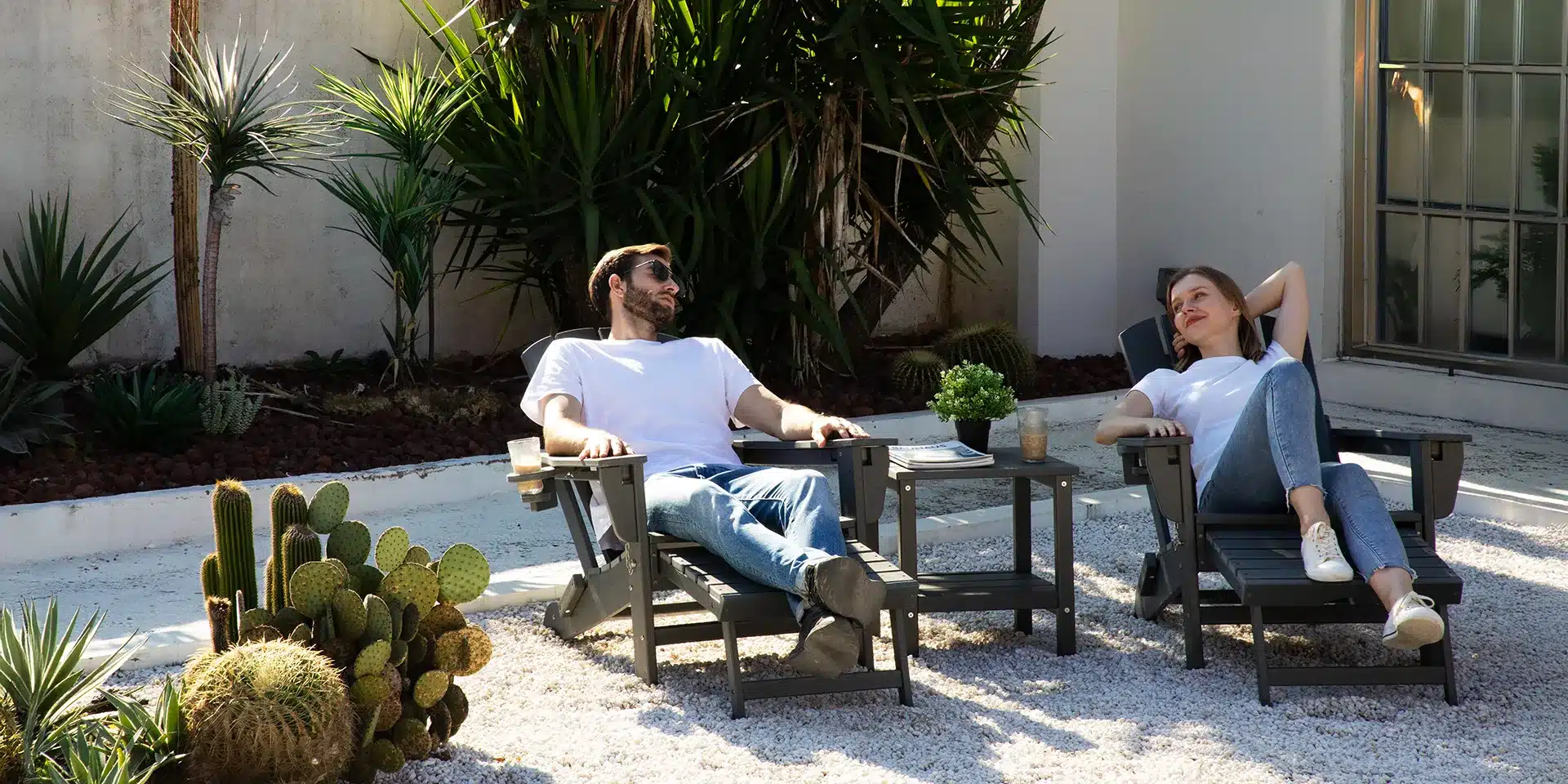 Men resting and chatting in reclining Adirondack chairs with pull-out footrests