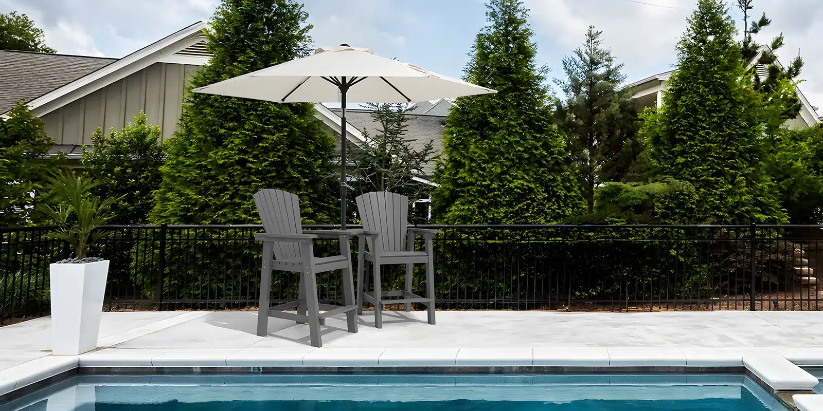 High Adirondack Chairs with Patio Umbrella by the Pool