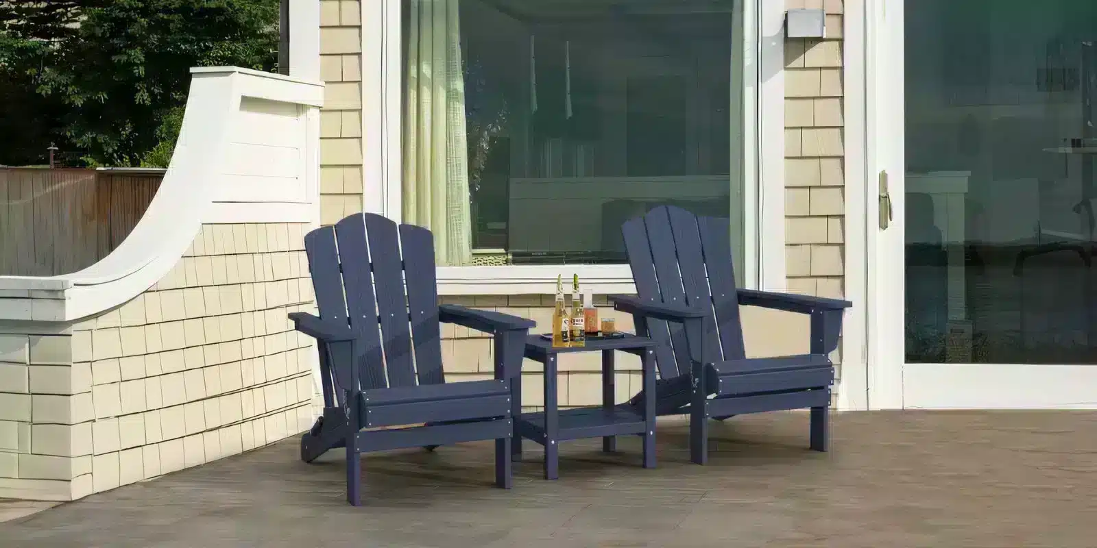 Navy Plastic Adirondack Chairs with Side Table on the Porch