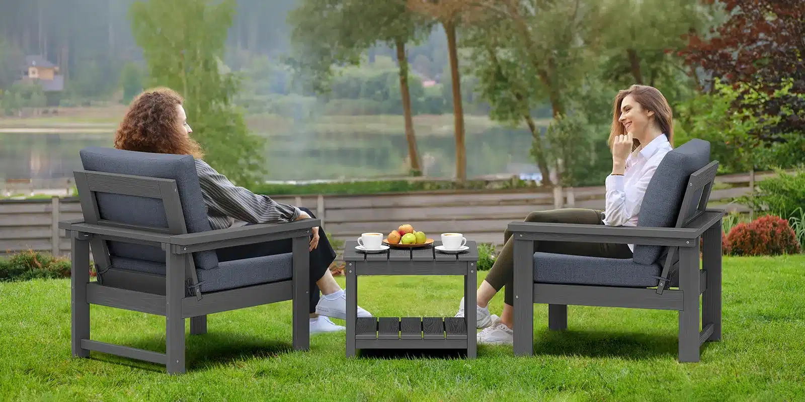 Girls chatting while sitting on the patio sofa set