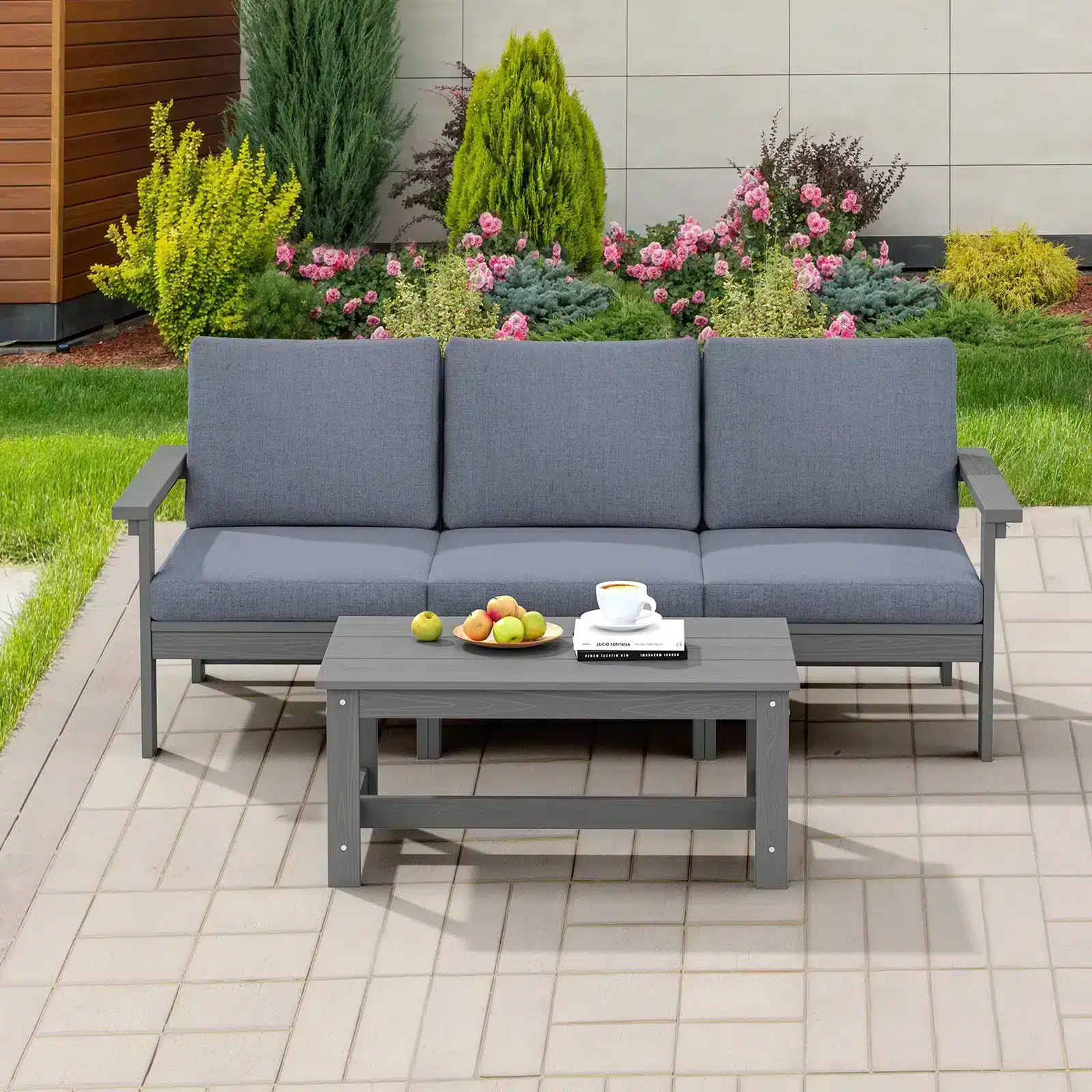 Three-seater Sofa and Coffee Table on the Garden