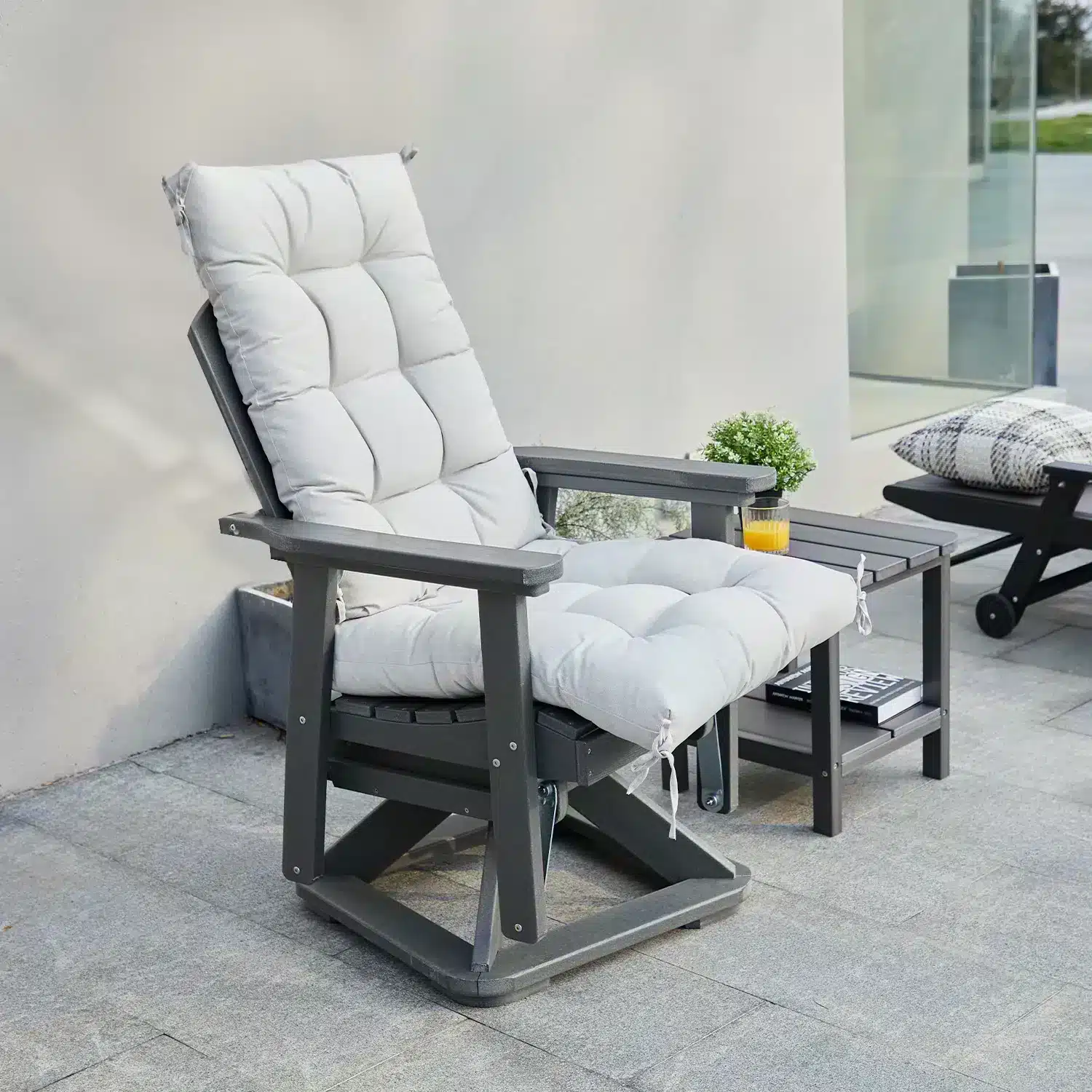 A Rocker Outdoor Swivel Glider with White Cushion