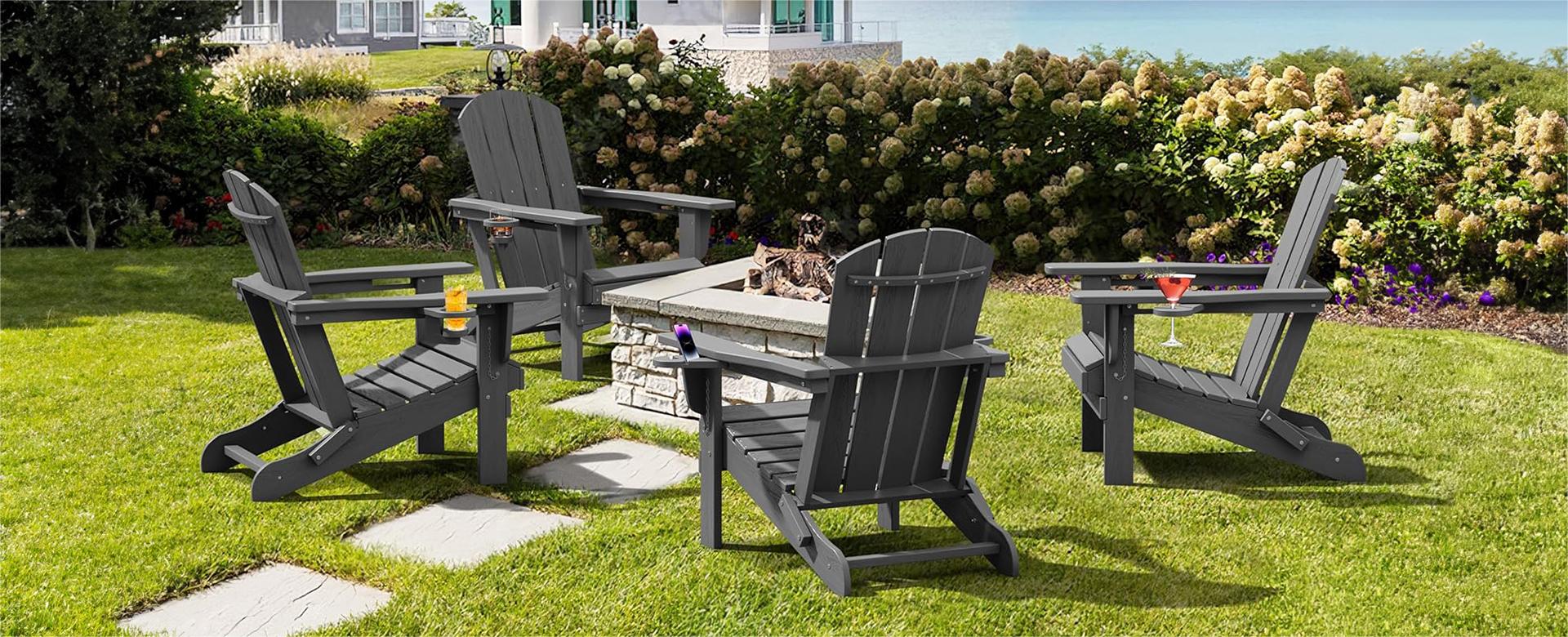 Four Classic Folding Adirondack Chairs on the Garden