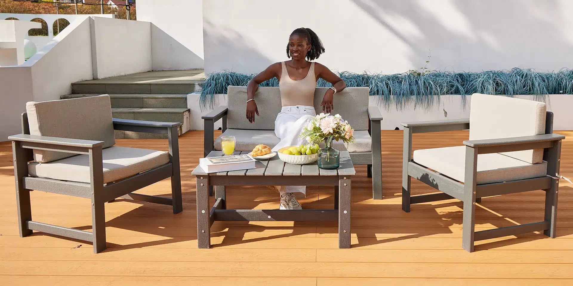 3-piece outdoor sofa set with rectangular outdoor coffee table on deck