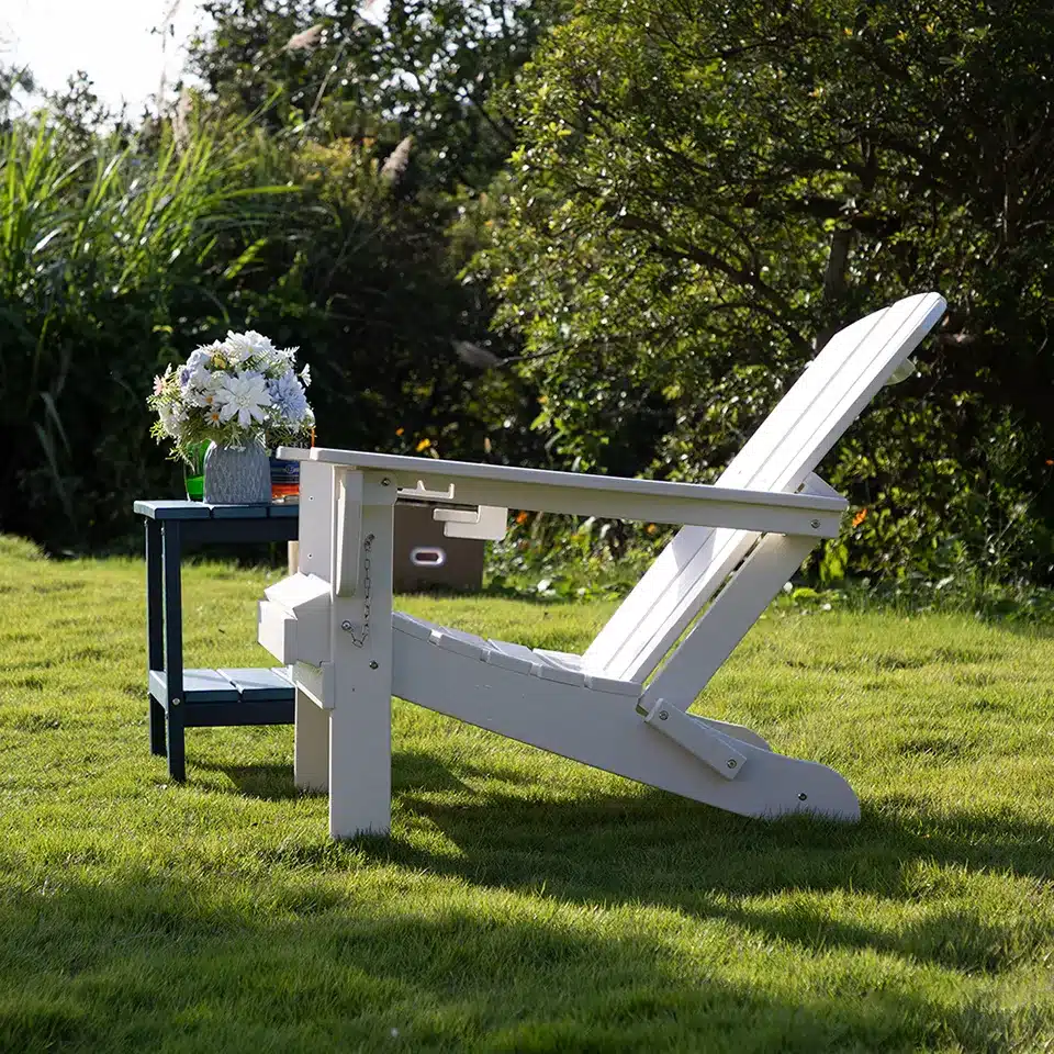 White Vintage Adirondack Chair with Reclining Backrest on the Grass