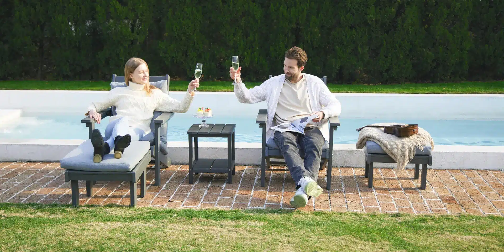 A couple drinks on an Adirondack Chair with cushion & footrest