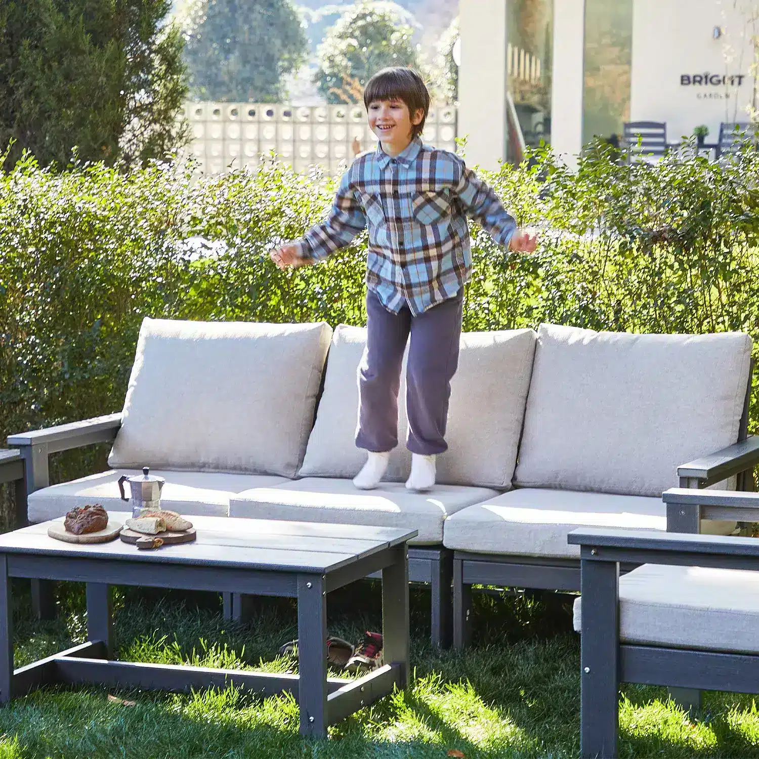 Boy Jumping on the 3 Seater Deep Seating Sofa