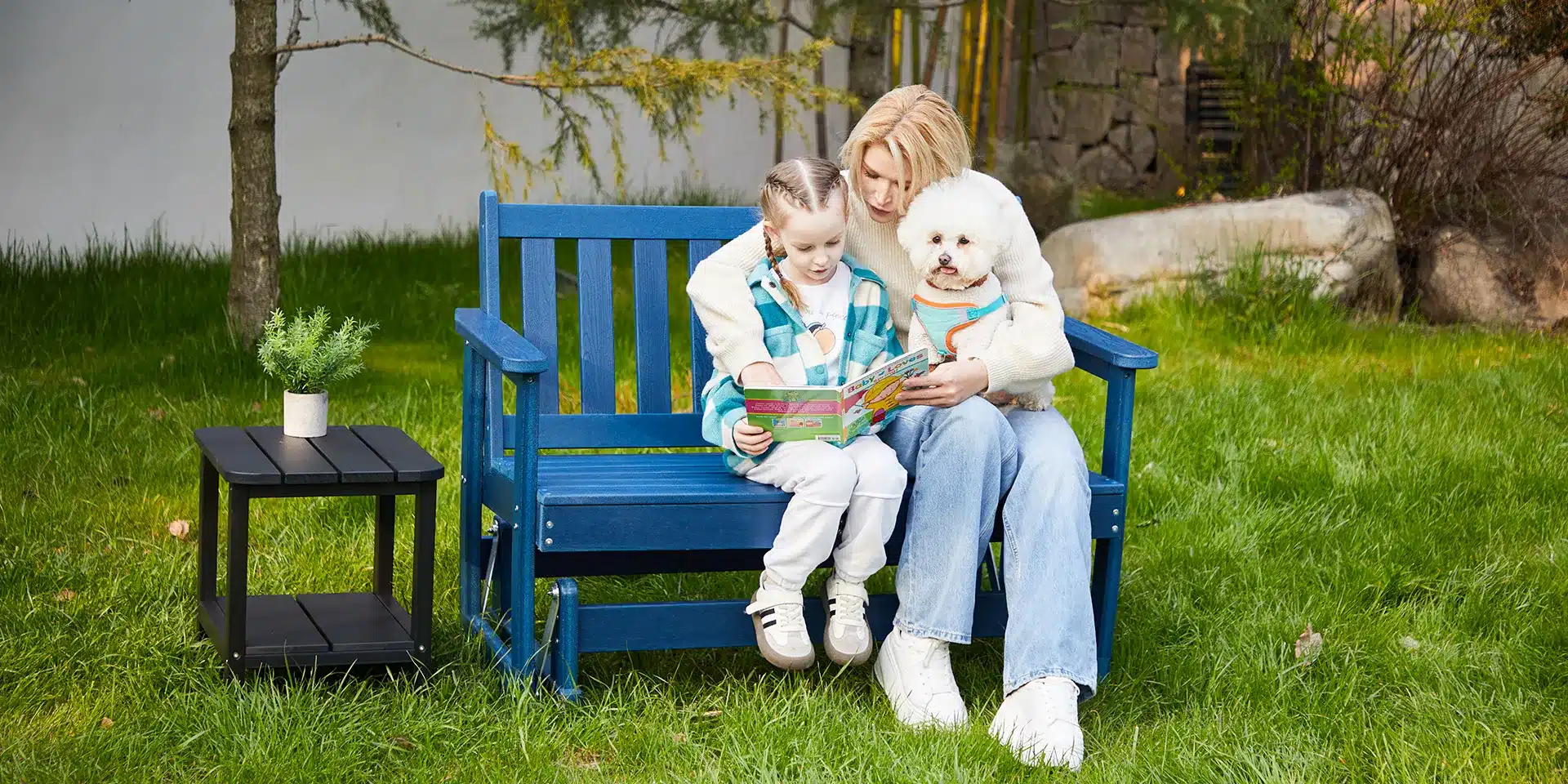 Mother and Daughter Read Books on the Glider Bench