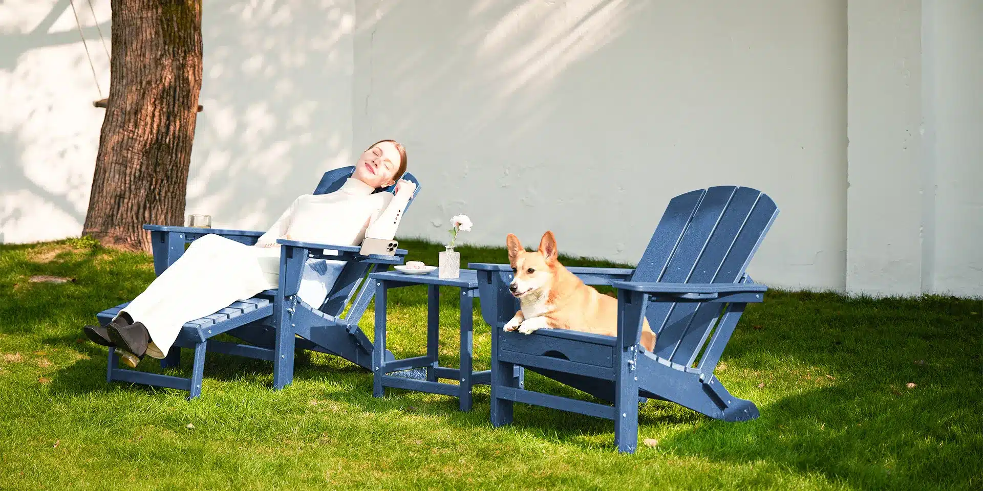 2 Piece Poly Adirondack Chair with Cup Holders on the Garden