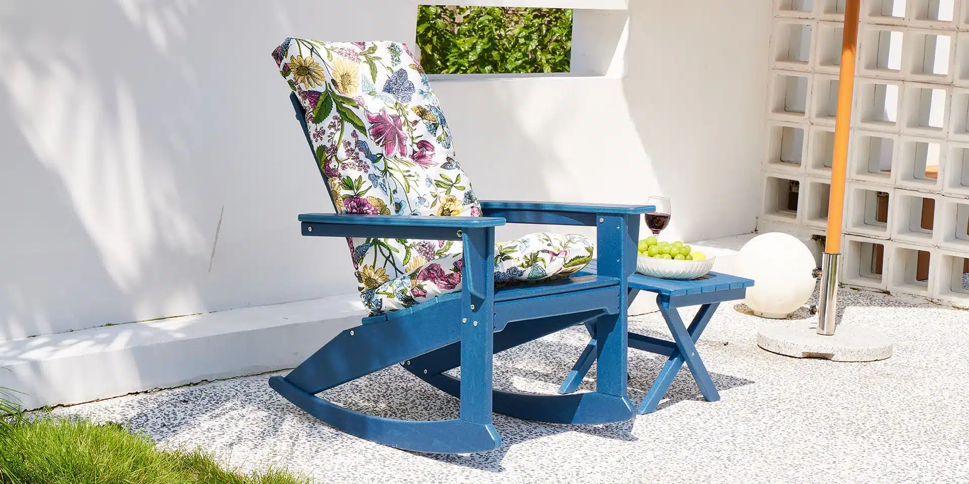 a rocking chair with a side table