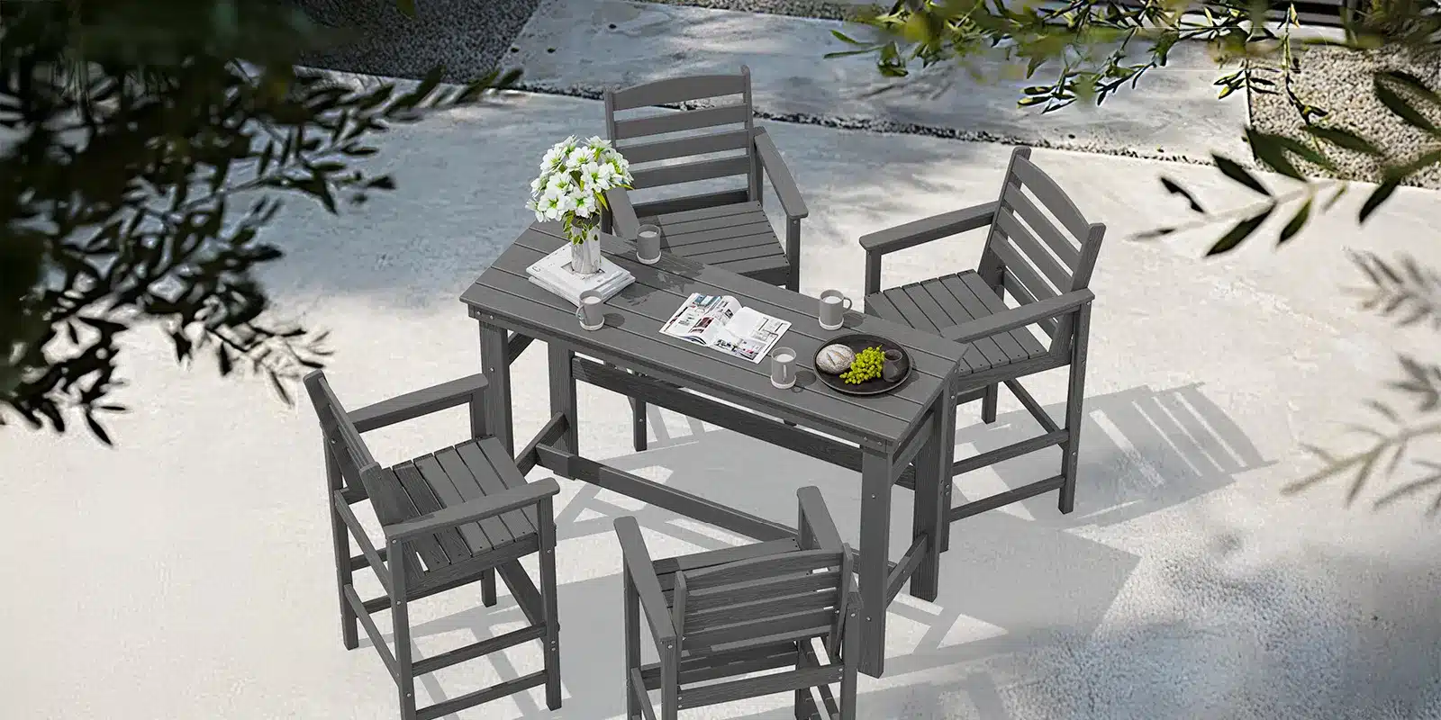 Outdoor Bar Height Table and Chair Set on the Garden