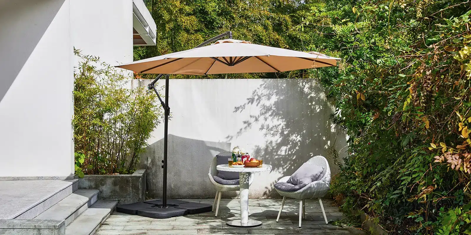 Patio Cantilever Umbrella with Base on the Garden