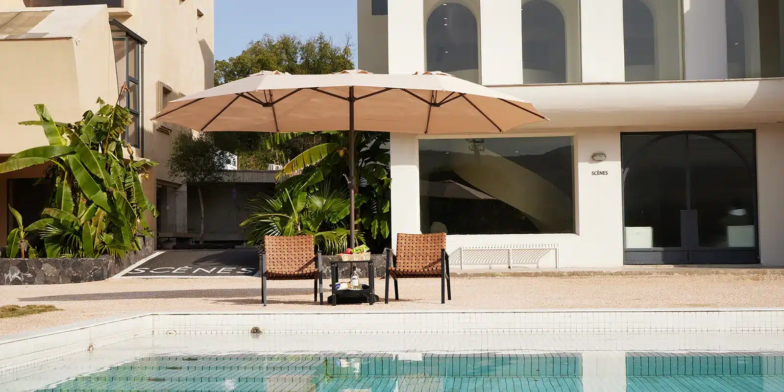 Double-sided Patio Market Umbrella with Chaise Lounge by the Poolside
