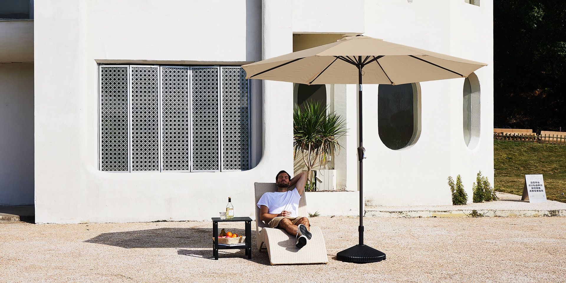 Outdoor 9ft Market Umbrella with Chaise Lounge on the Patio